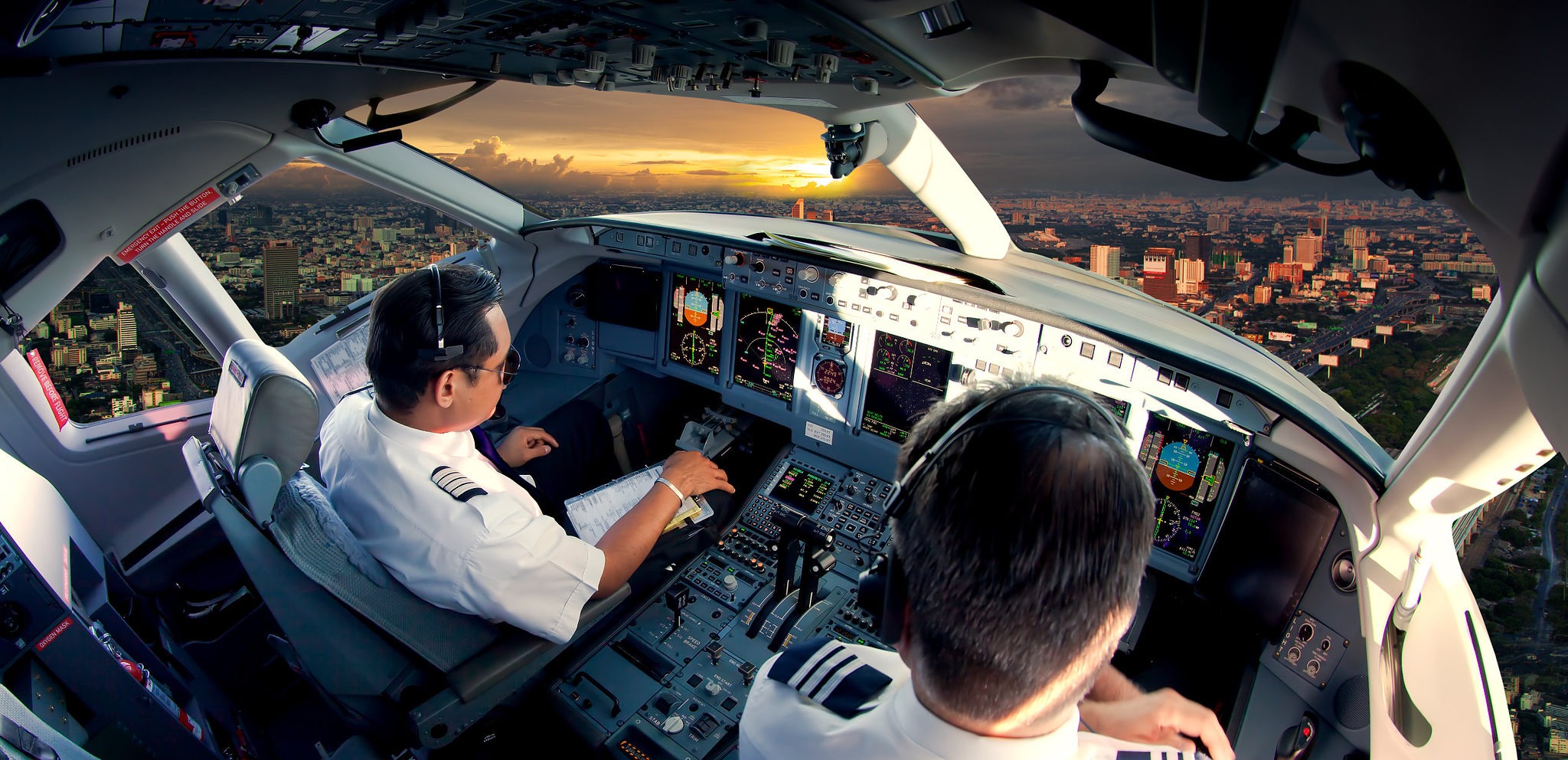 Cockpit of modern passenger jet aircraft. Pilots at work - SKY academy